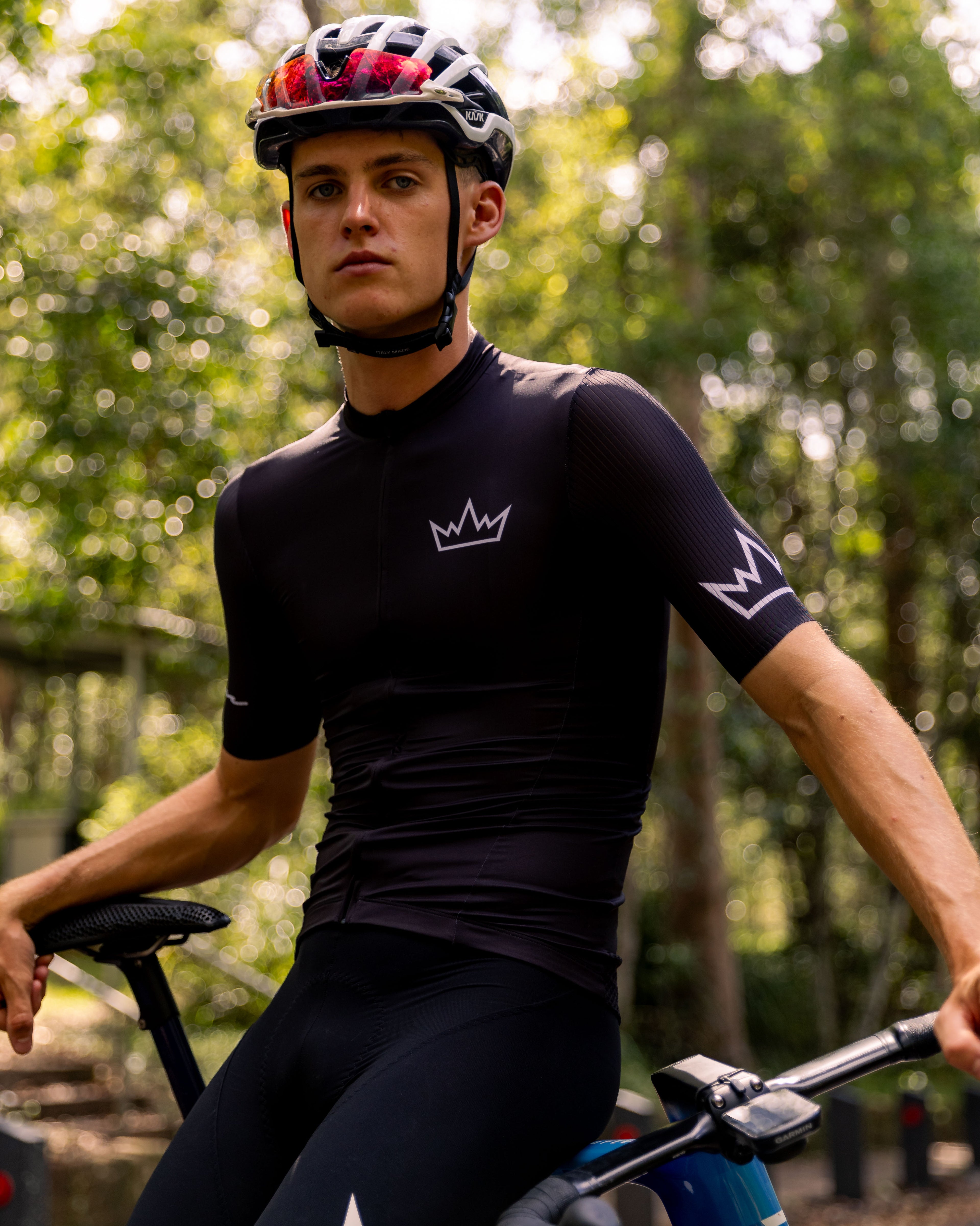 Man wearing THRONE Phase 1 black cycling jersey