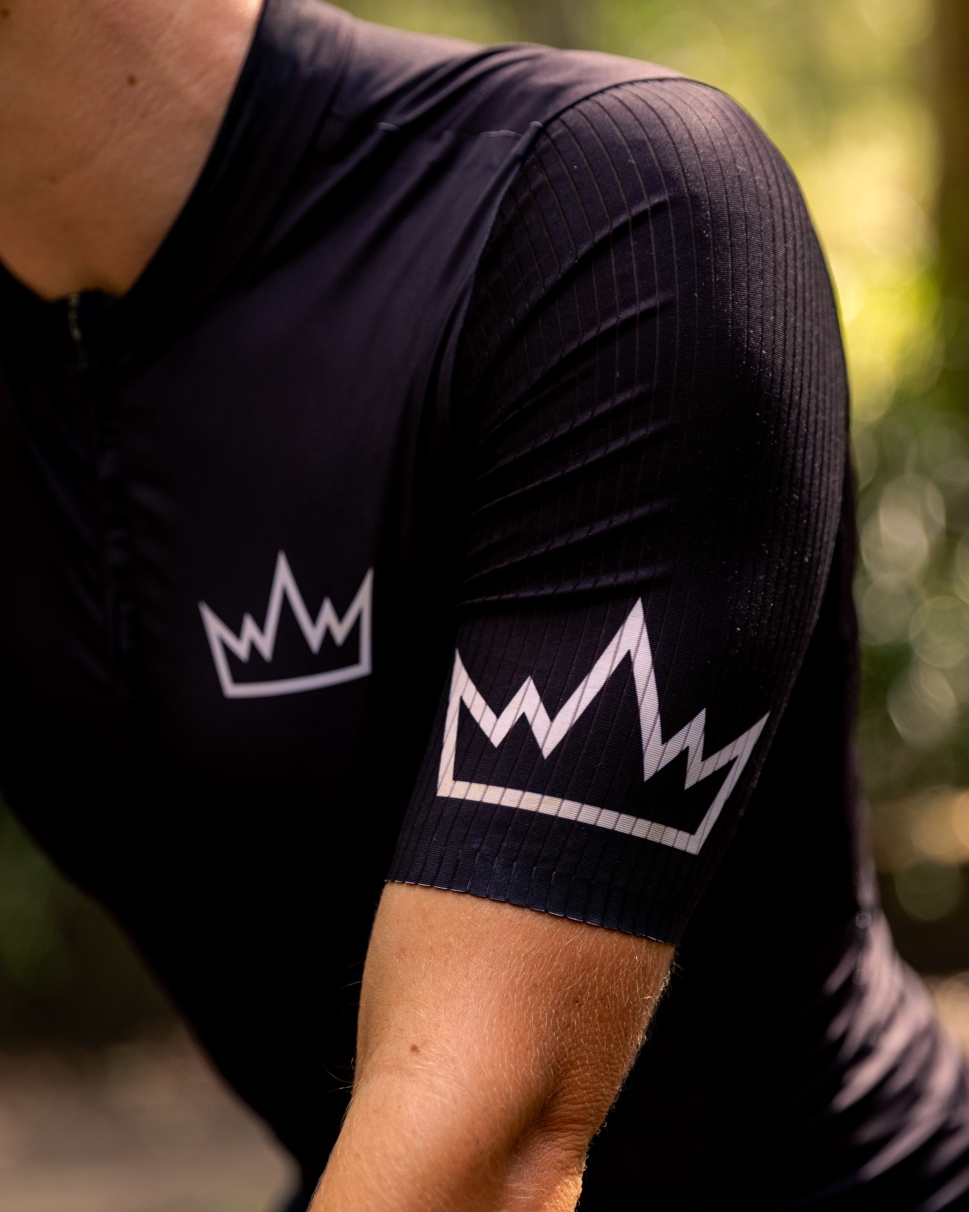 Woman wearing THRONE Phase 1 black cycling jersey
