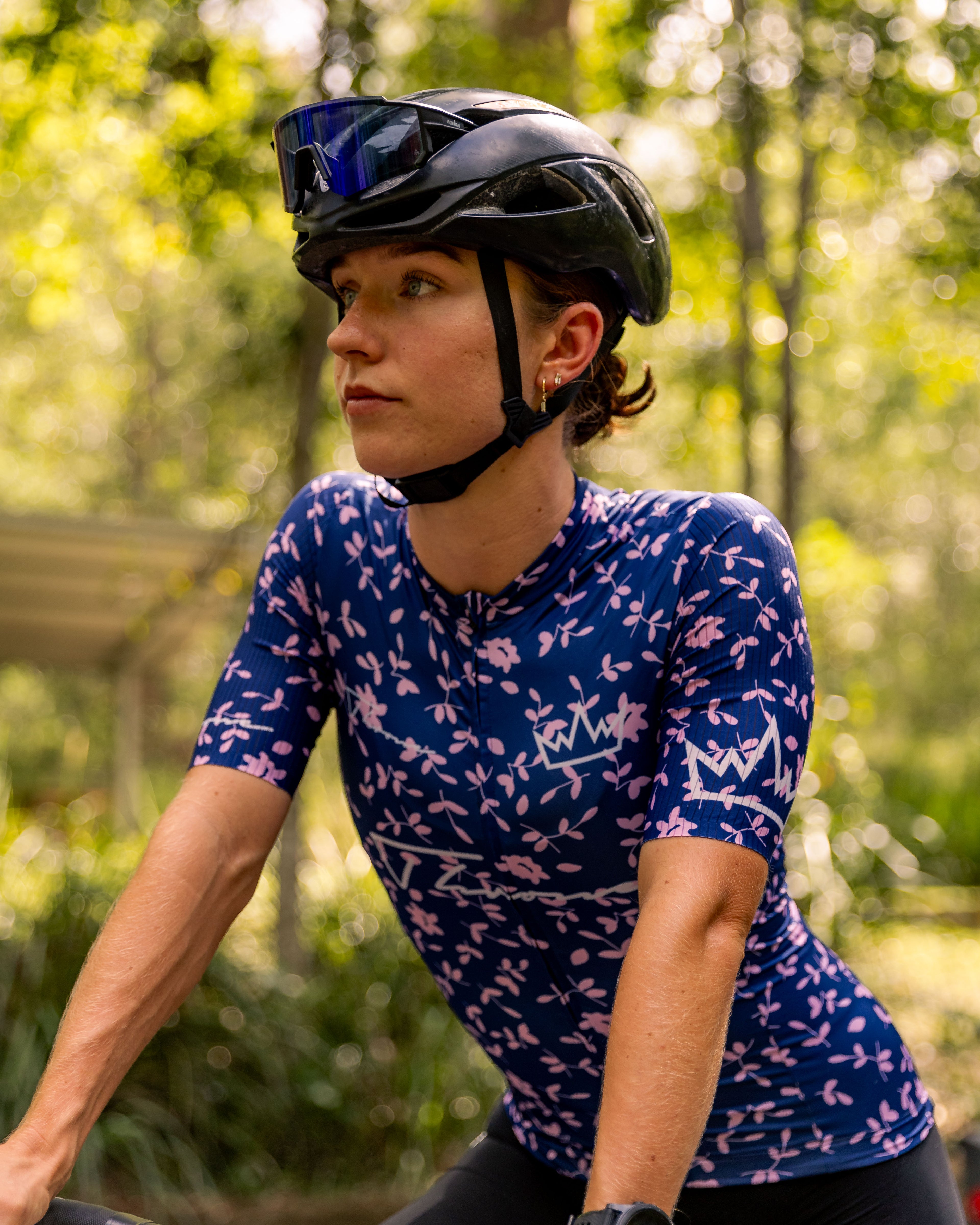 Woman wearing THRONE Phase 1 Abby purple cycling jersey