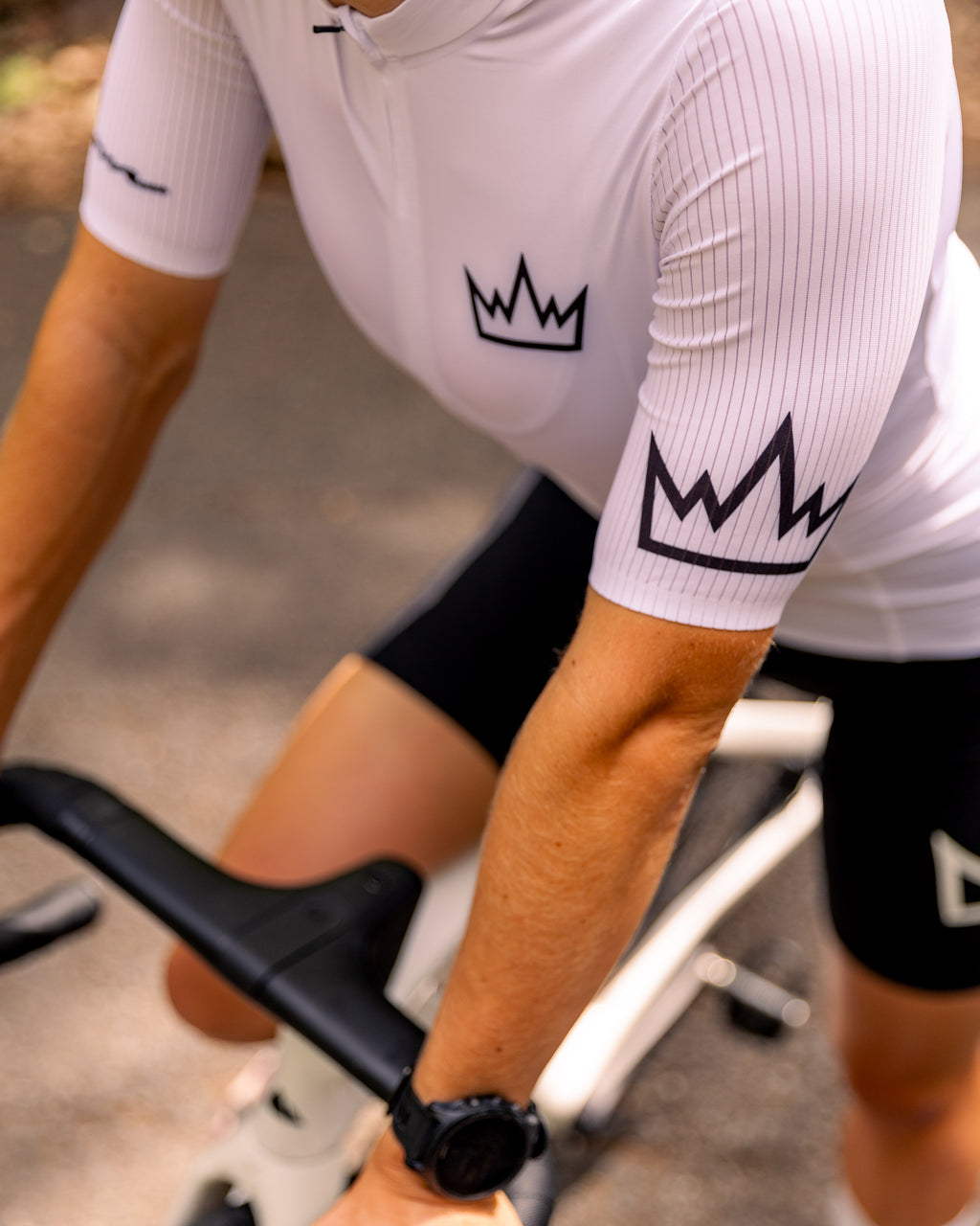 Woman wearing THRONE Phase 1 white cycling jersey