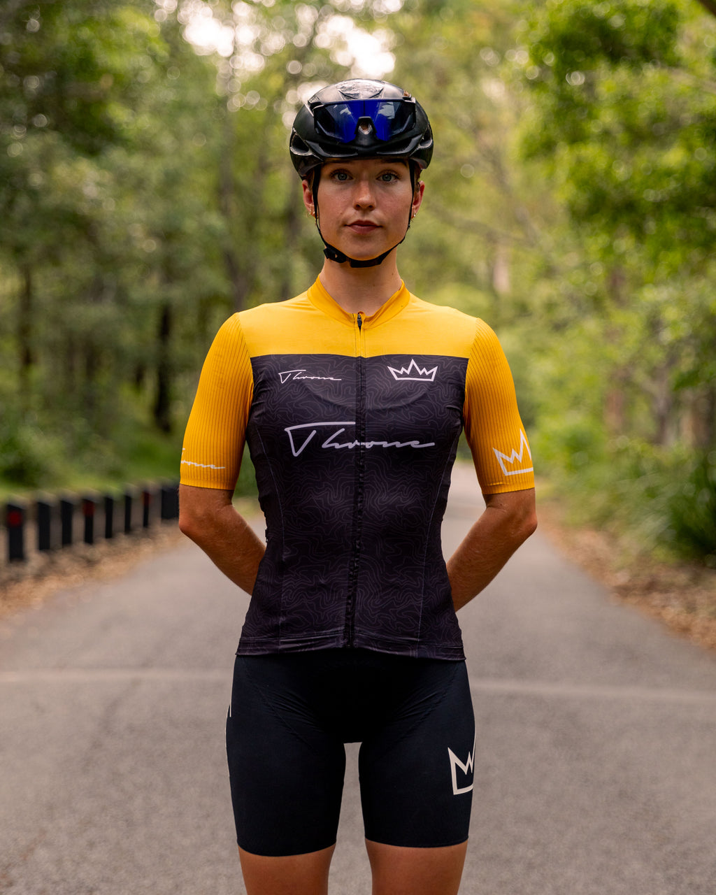Woman wearing THRONE Phase 1 Stacia orange cycling jersey