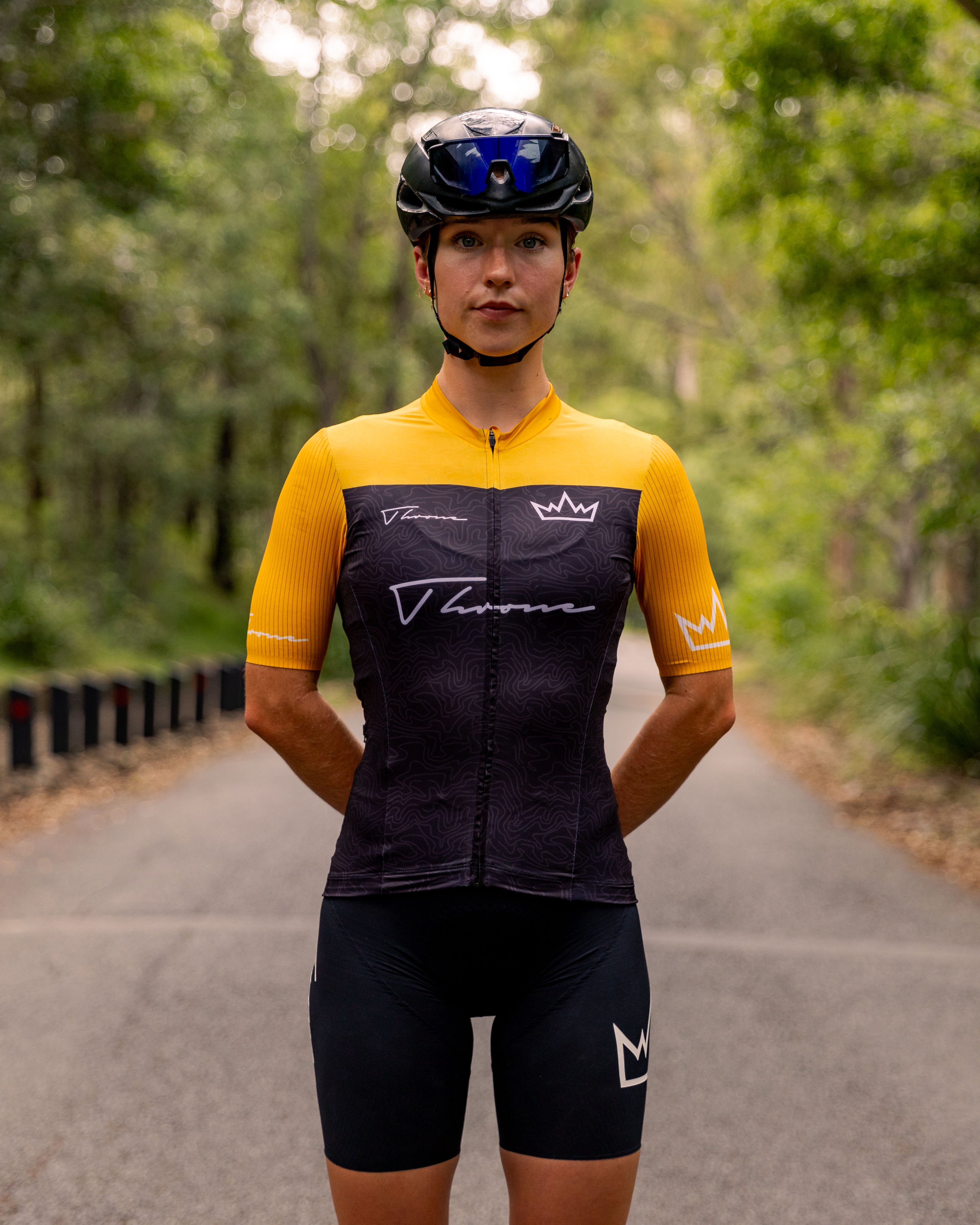 Woman wearing THRONE Phase 1 Stacia orange cycling jersey