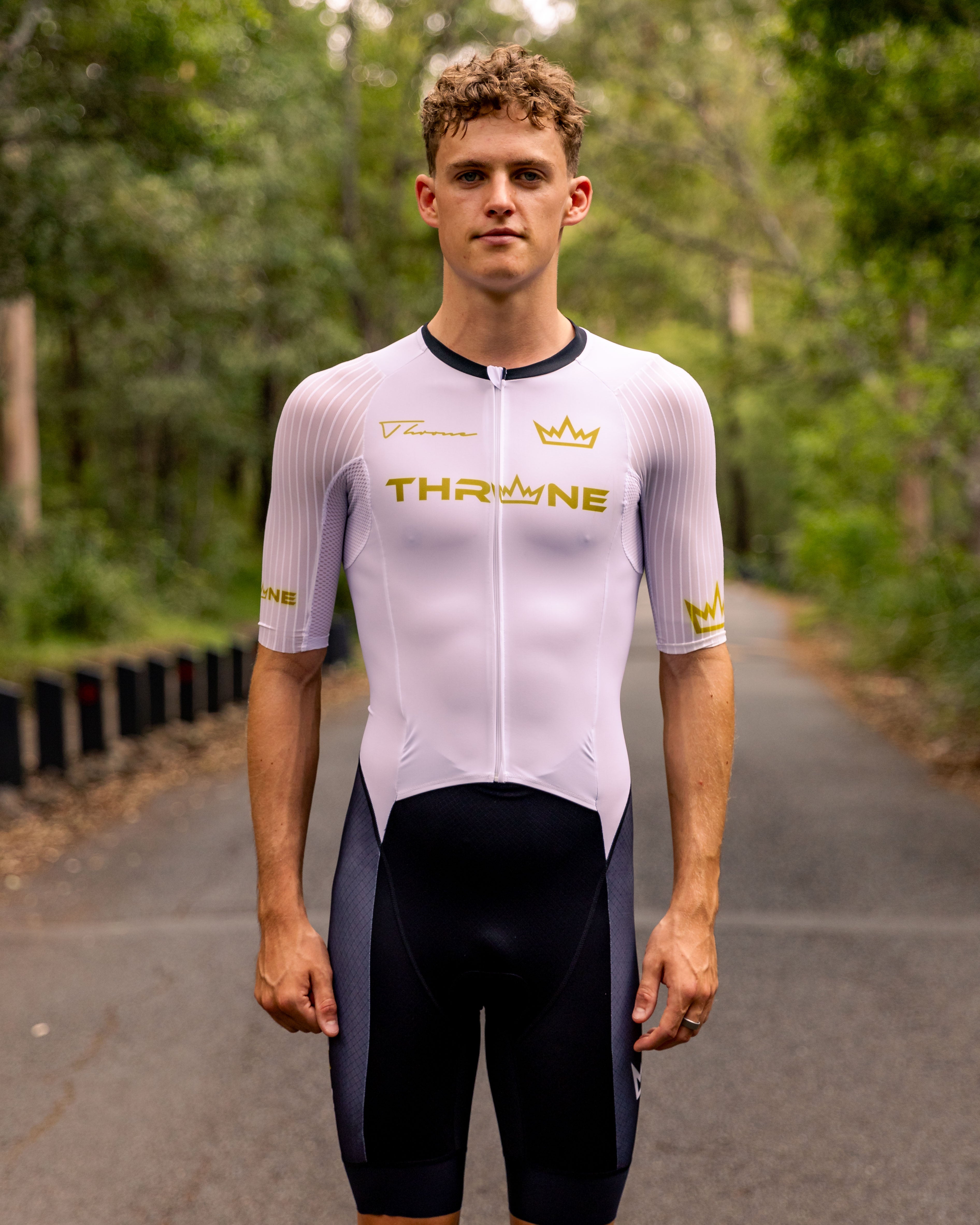 Man wearing THRONE VALOR white short-sleeve trisuit