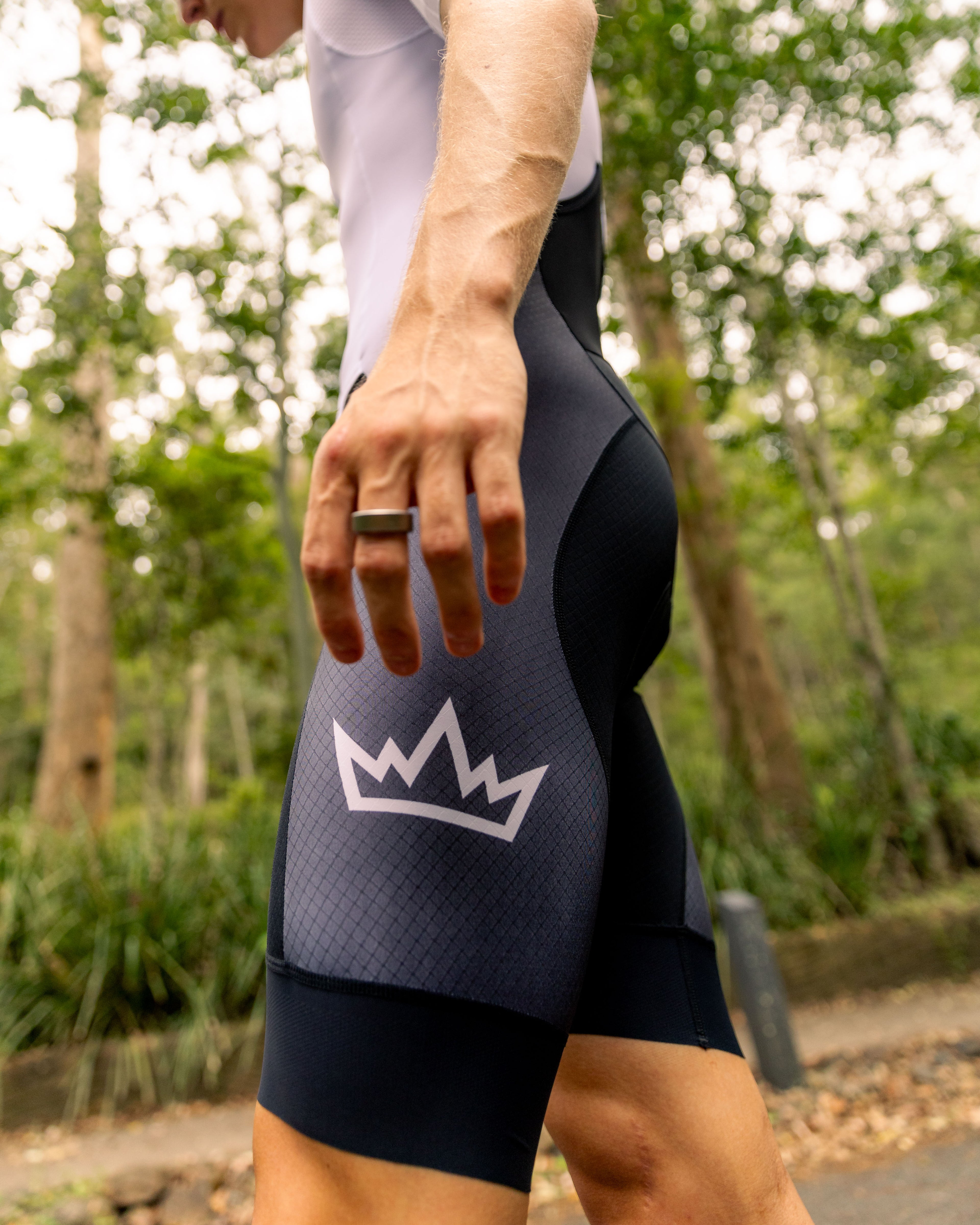 Man wearing THRONE VALOR white short-sleeve trisuit
