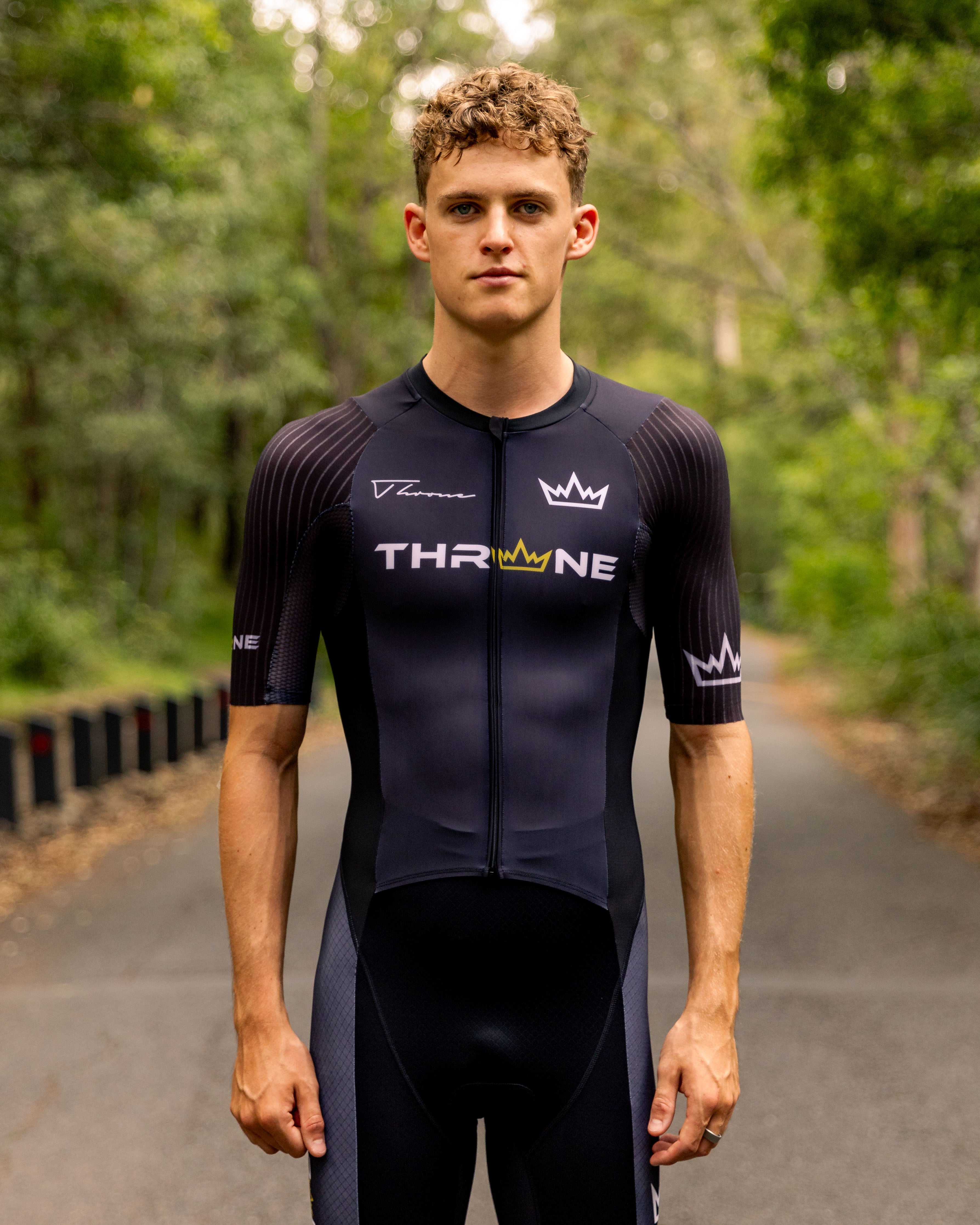Man wearing THRONE VALOR black short-sleeve trisuit