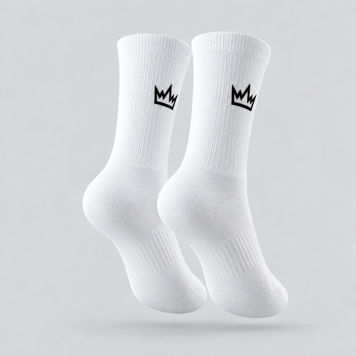 FDTN white cycling socks with crown branding on the sides