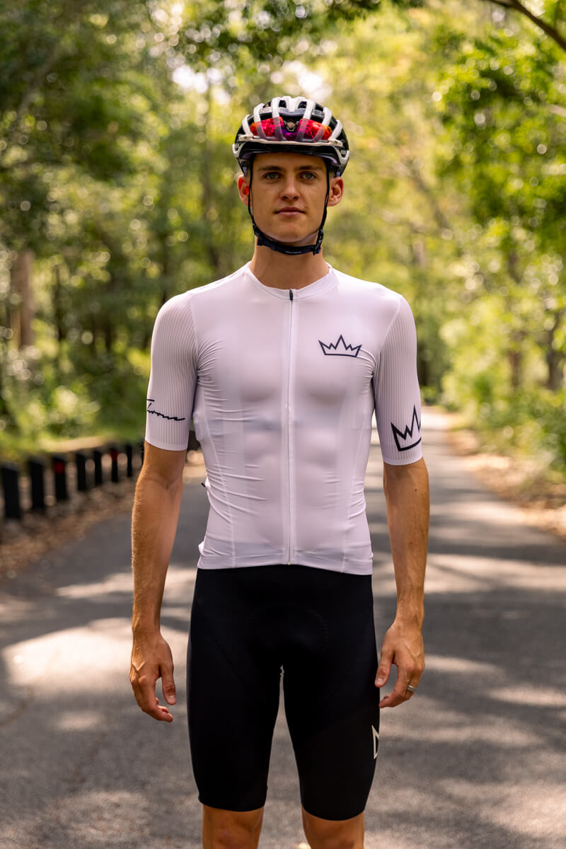Man wearing THRONE Phase 1 white cycling jersey