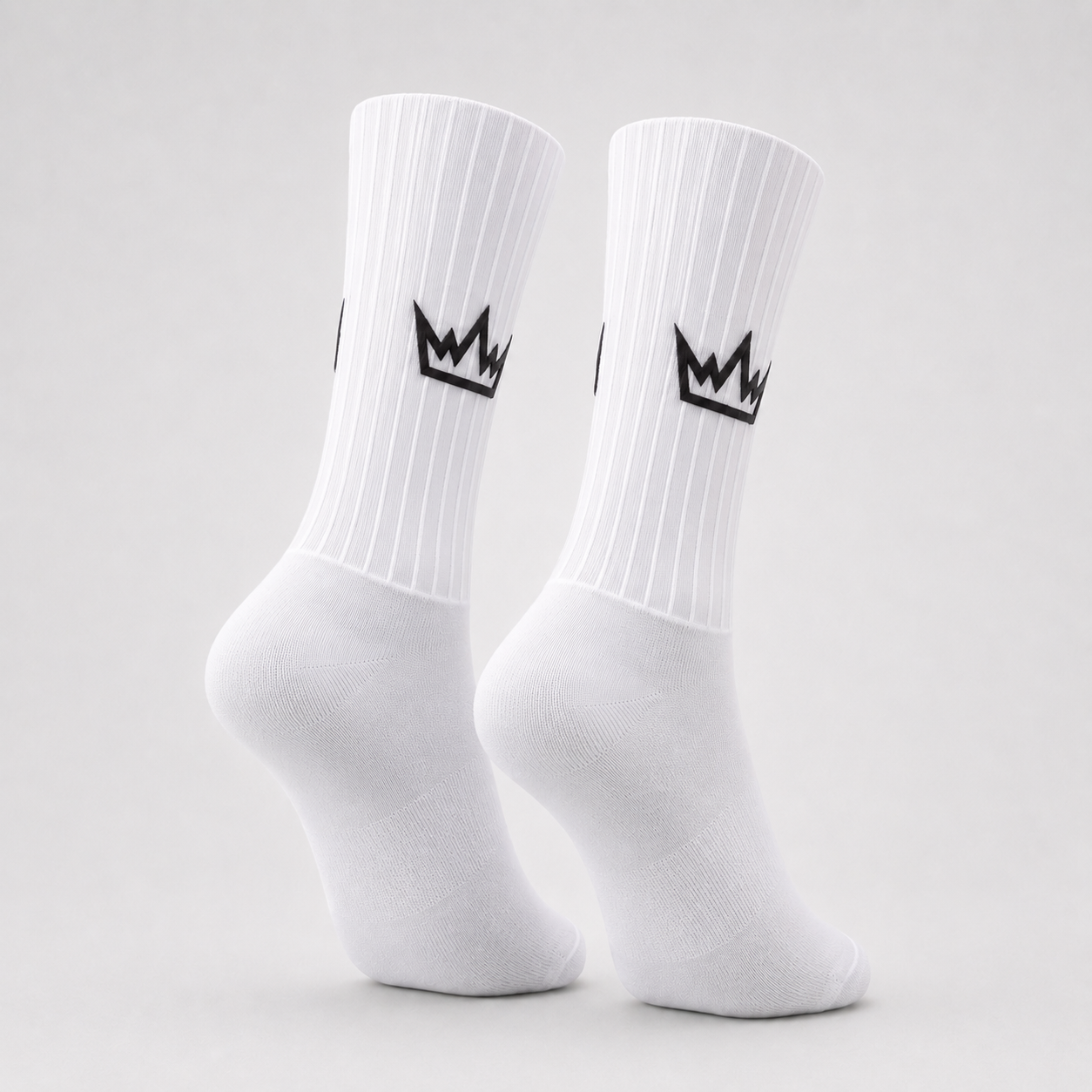 THRONE Aero Socks in white, ghost mannequin product view with black crown branding