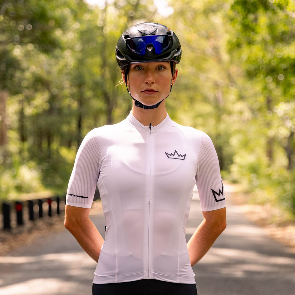 Woman wearing THRONE Phase 1 white cycling jersey