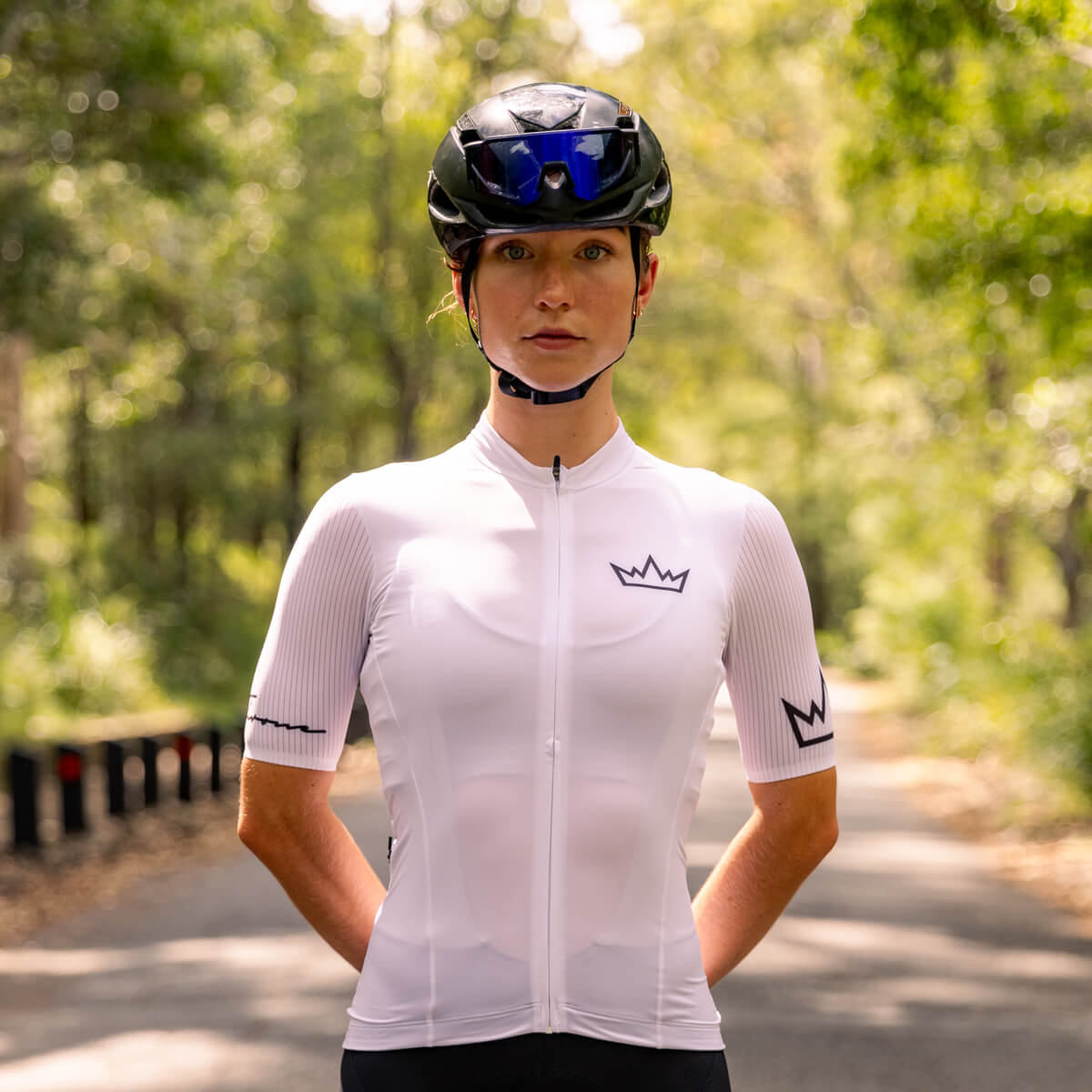 Woman wearing THRONE Phase 1 white cycling jersey